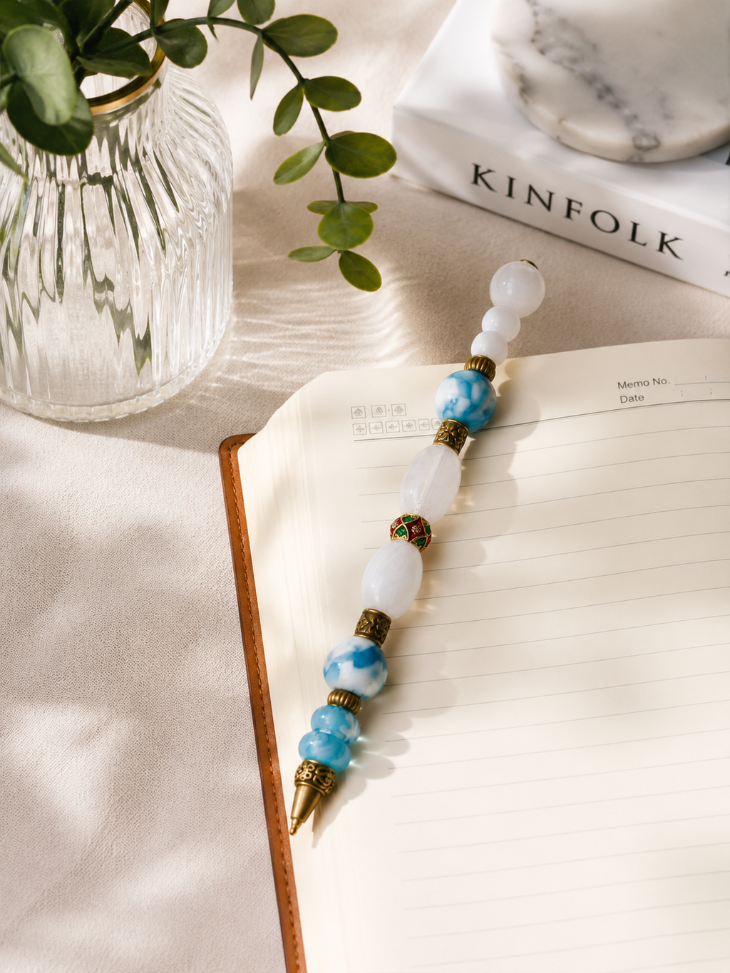 Elegant desk vignette with the Cloudwork beaded pen