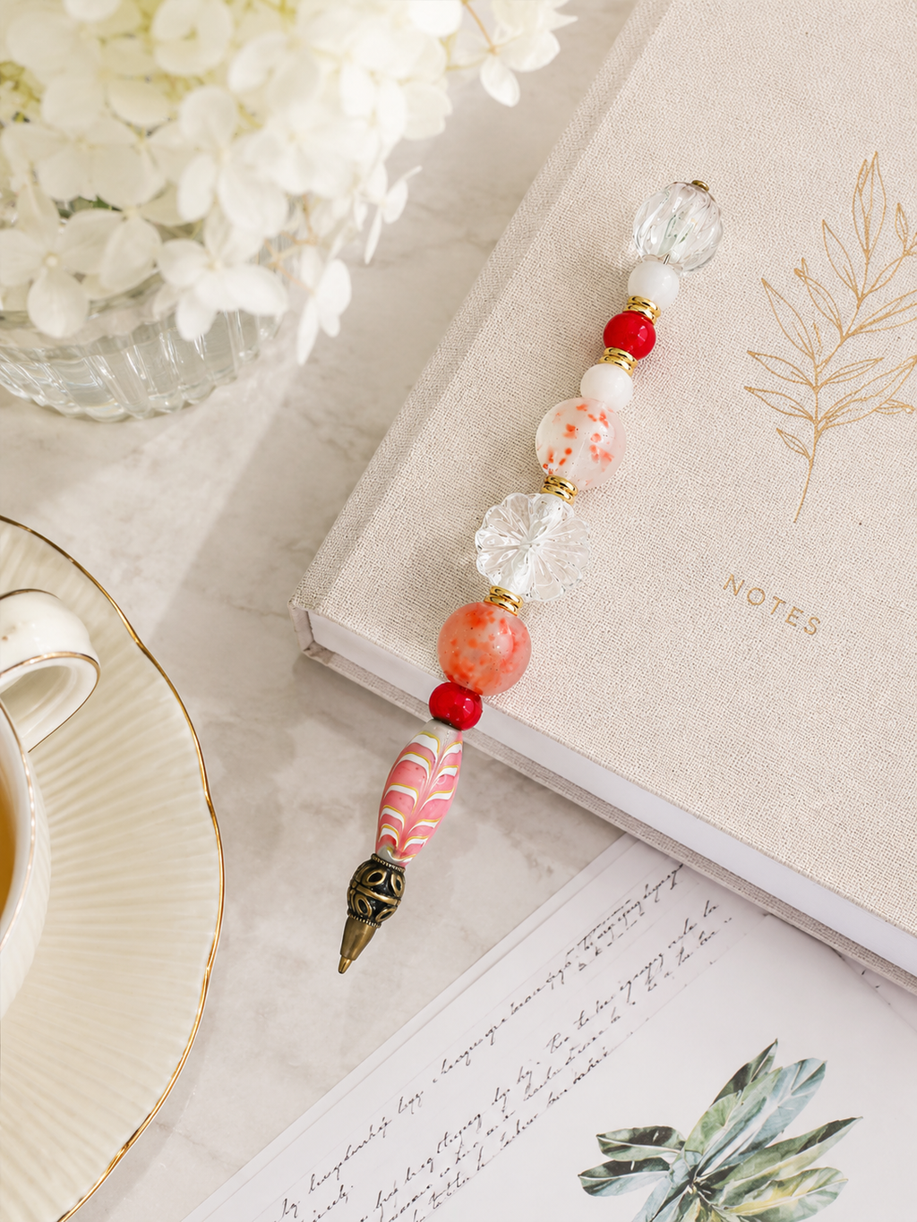 Elegant desk vignette with the Coral Bloom beaded pen